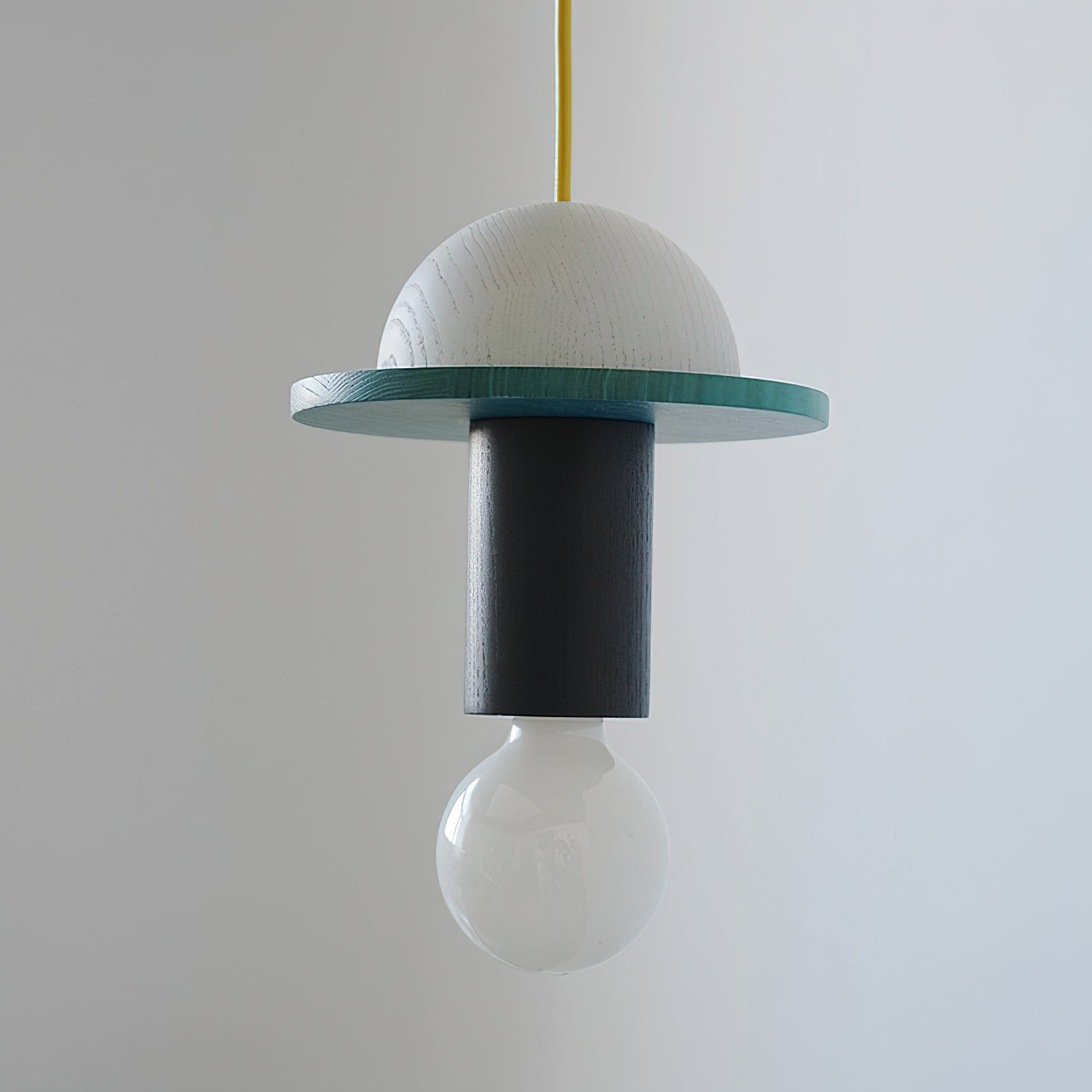 Close-up on the wooden and metal details of the pendant light.
