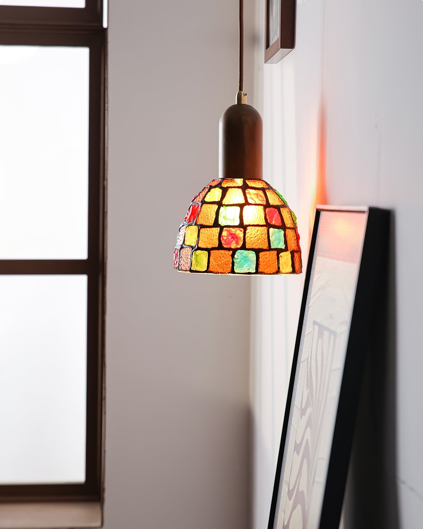 Klima Pendant Light shown against a dark background to emphasize its colors.