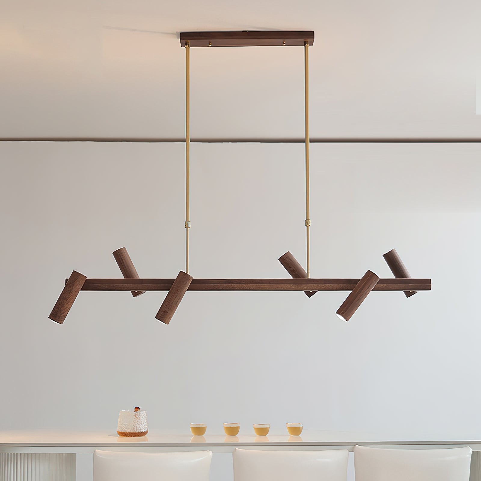 Konnect Wood Chandelier hanging over a contemporary dining table.