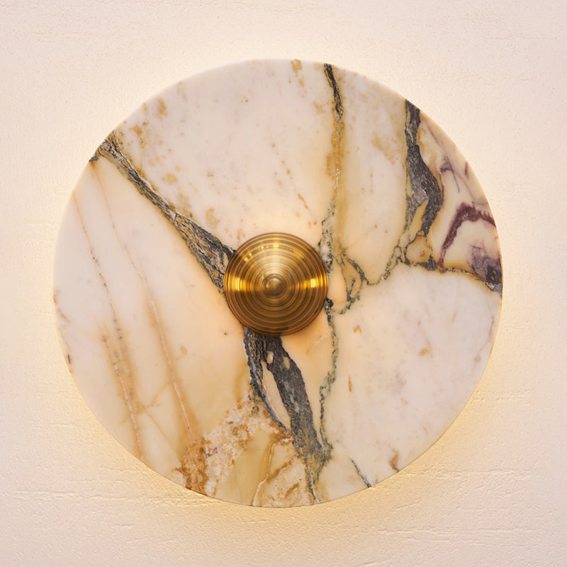 The texture of a beige travertine wall lamp, close-up.