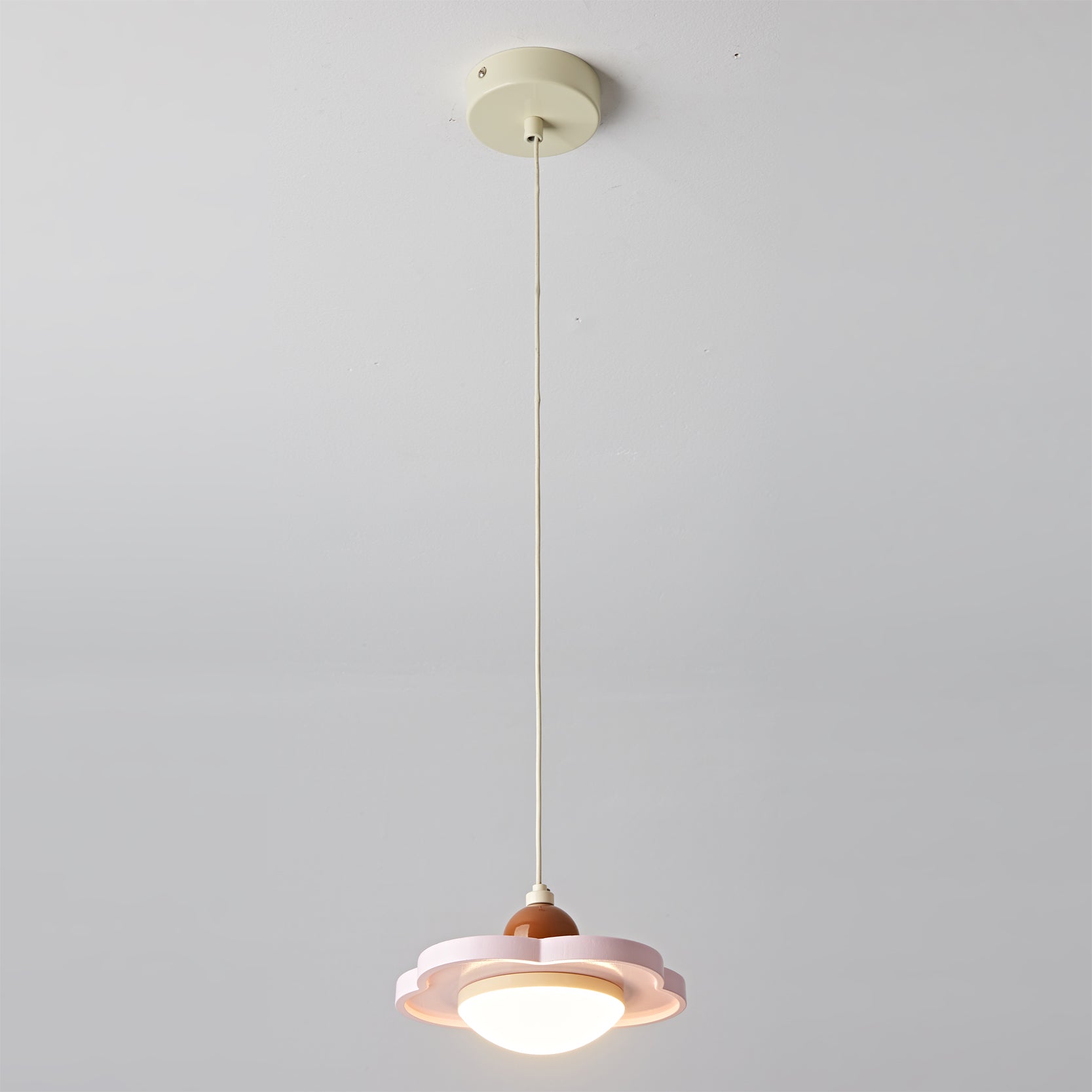 Side profile of the Laguna Pendant Light in pink.