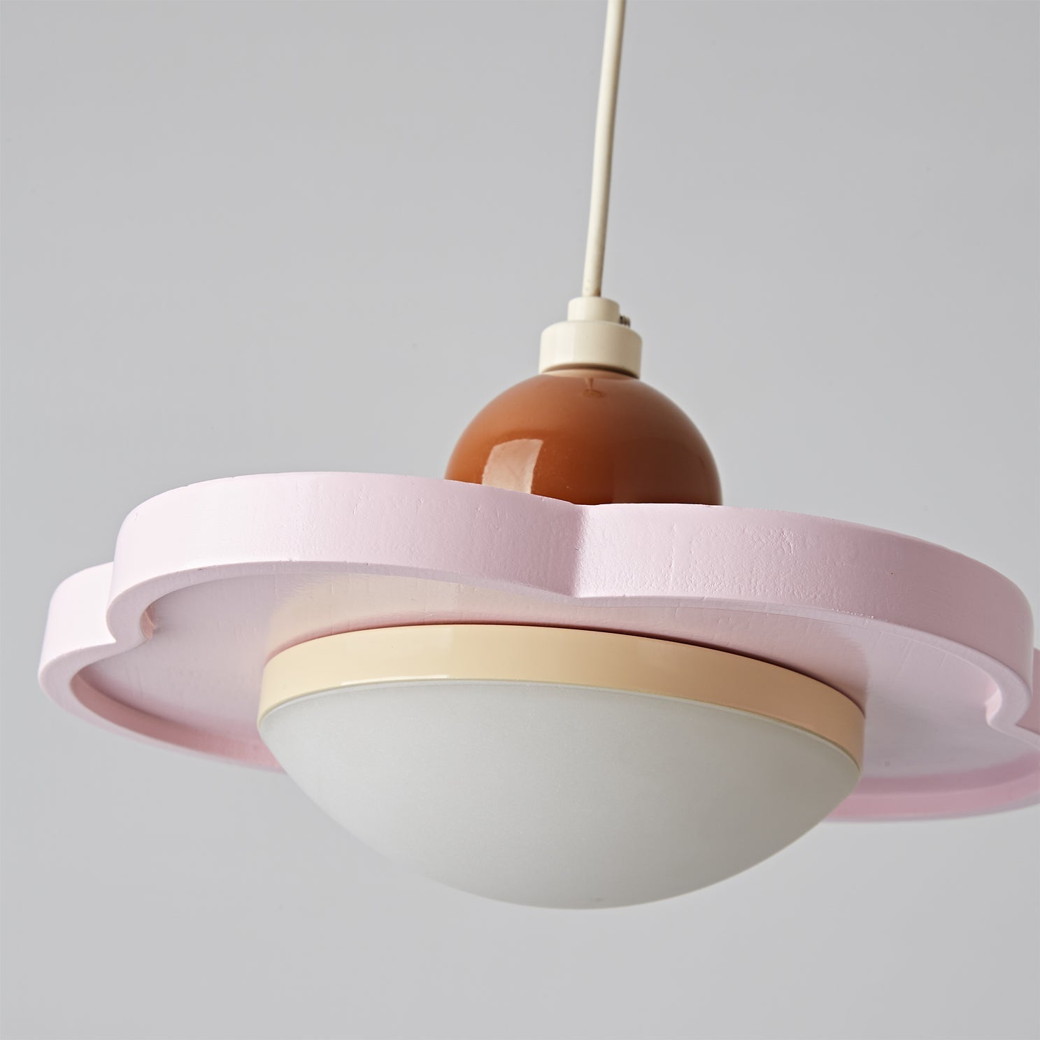The pendant light shown with its suspension wire.