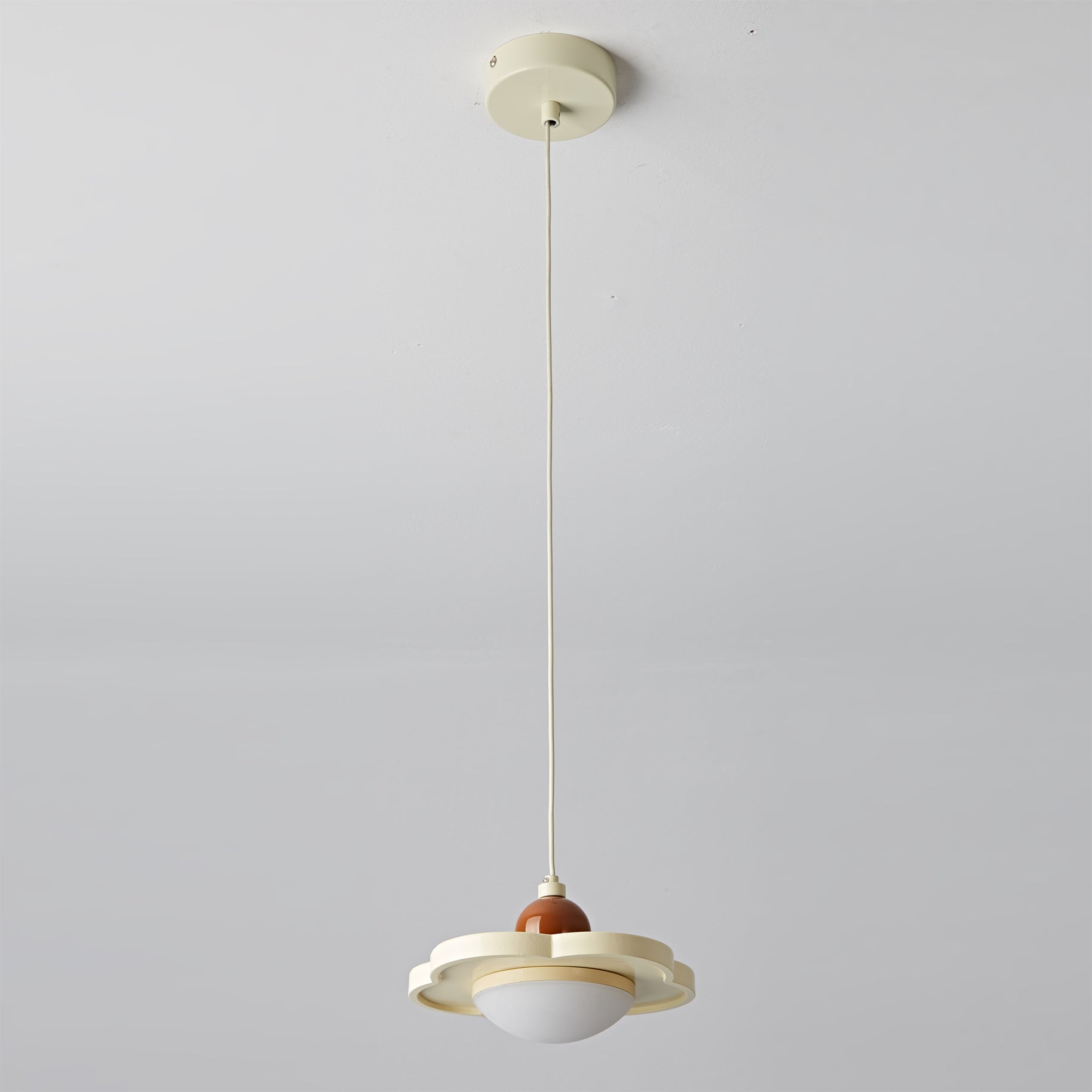 The cream Laguna Pendant Light styled in a minimalist space.