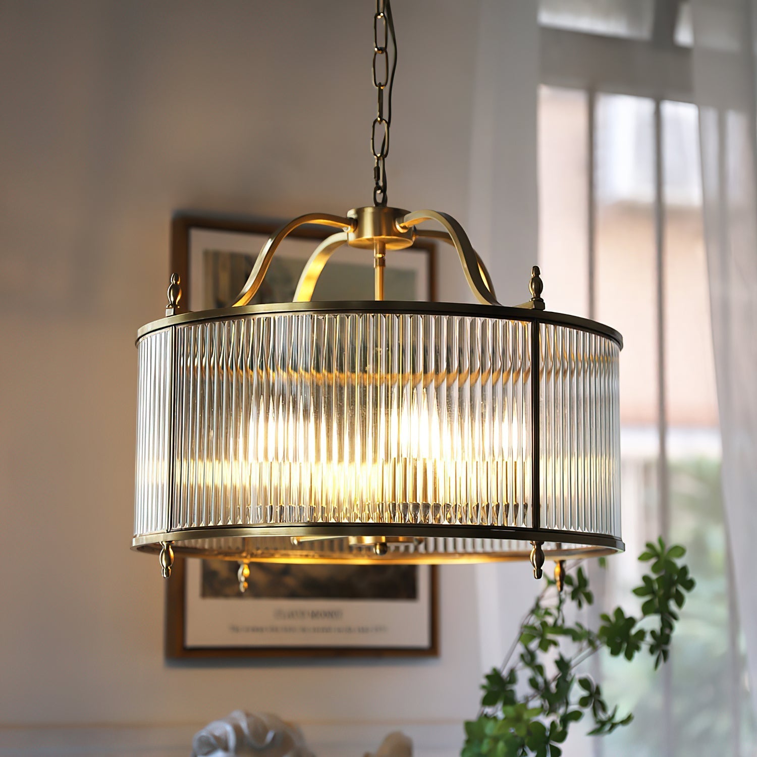 Close-up view of the Lambeth Chandelier's ribbed glass and gold copper frame.