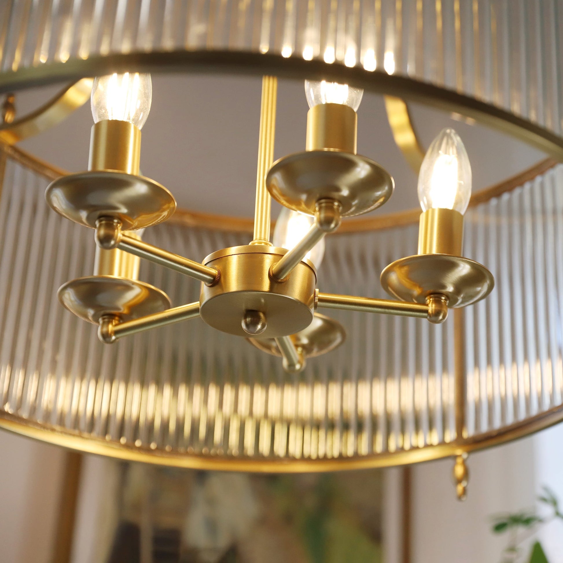 The 4-head version of the Lambeth Glass Chandelier on a white background.