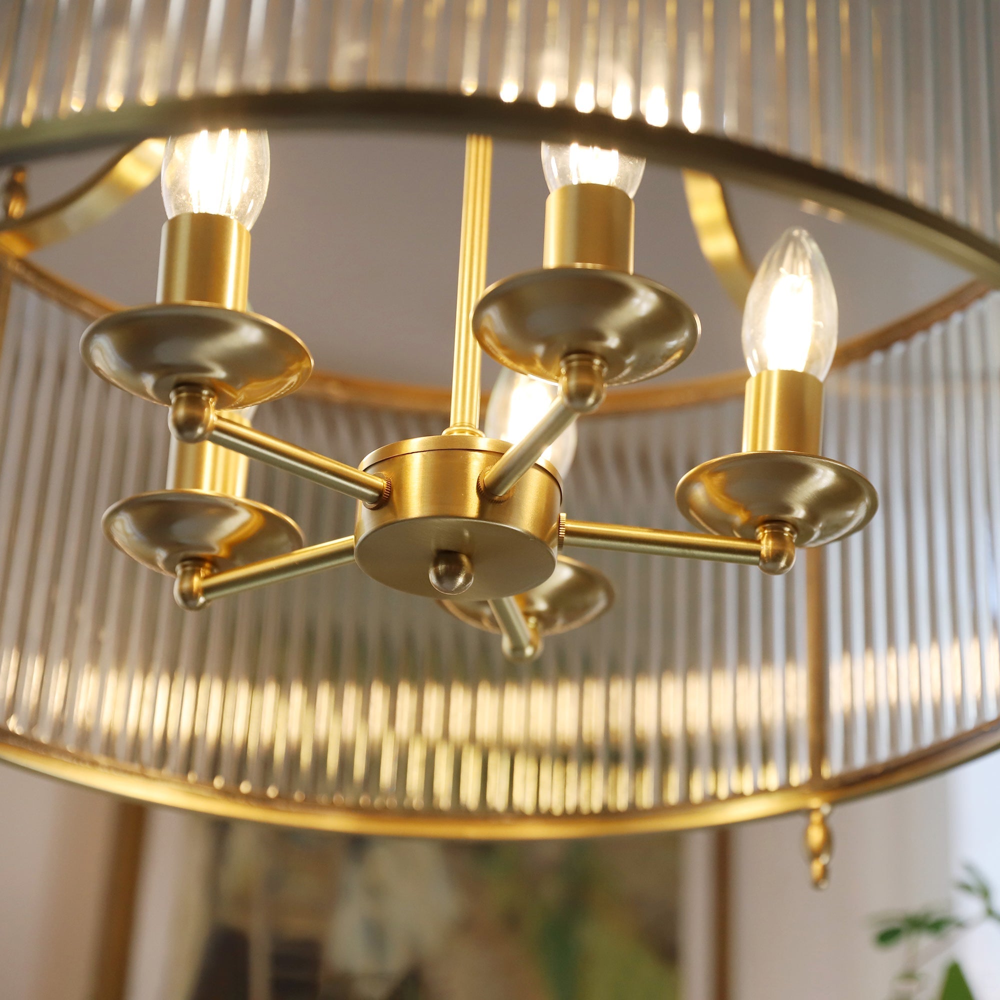 The 4-head version of the Lambeth Glass Chandelier on a white background.