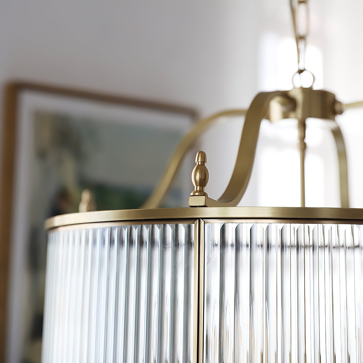 Lifestyle view of the Lambeth Chandelier hanging above a modern staircase.