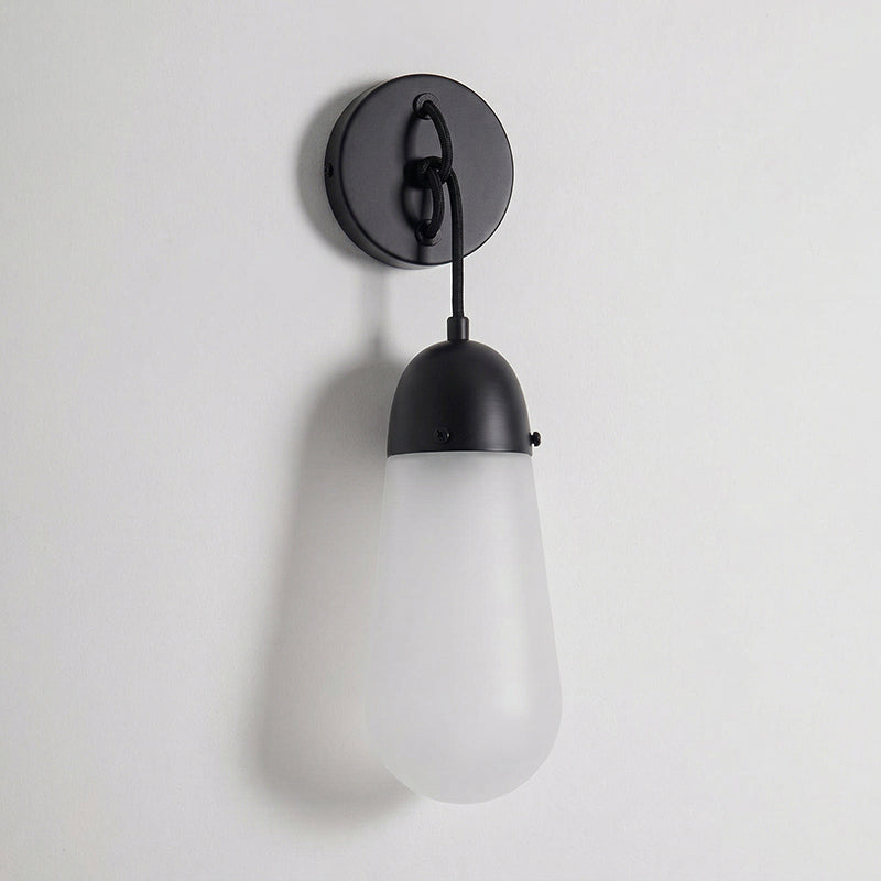 The brass body of the Lariat Wall Lamp, highlighting the material finish.