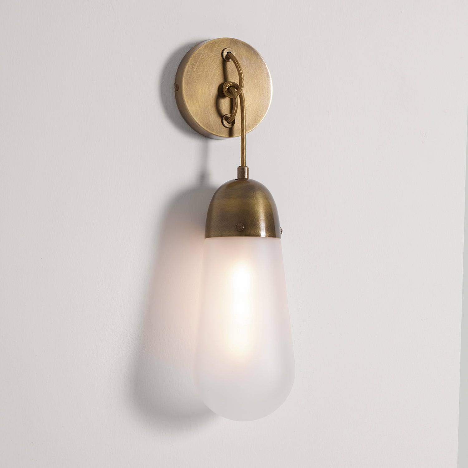 Lariat Wall Lamp installed on a dark-colored wall for contrast.