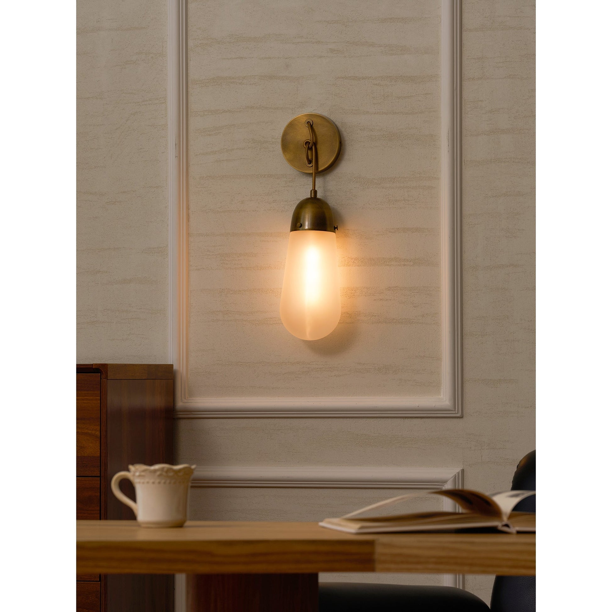 Lariat Wall Lamp in white finish in a minimalist living room.
