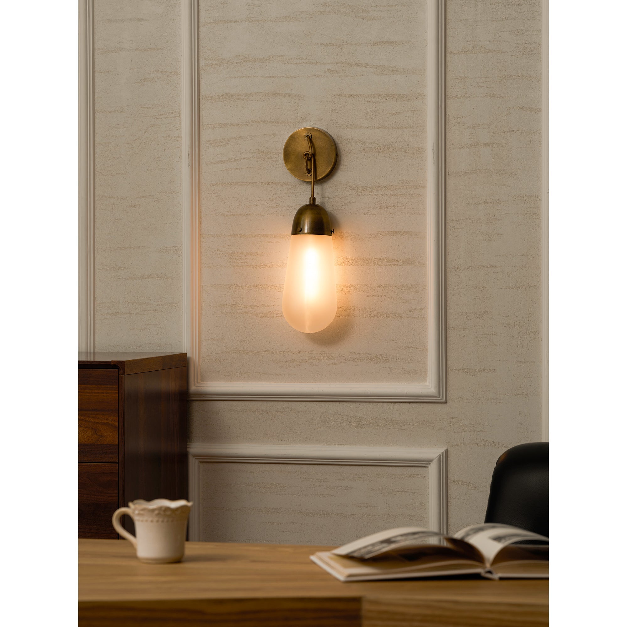 Comparison of the bronze, black, and white finishes of the Lariat Wall Lamp.