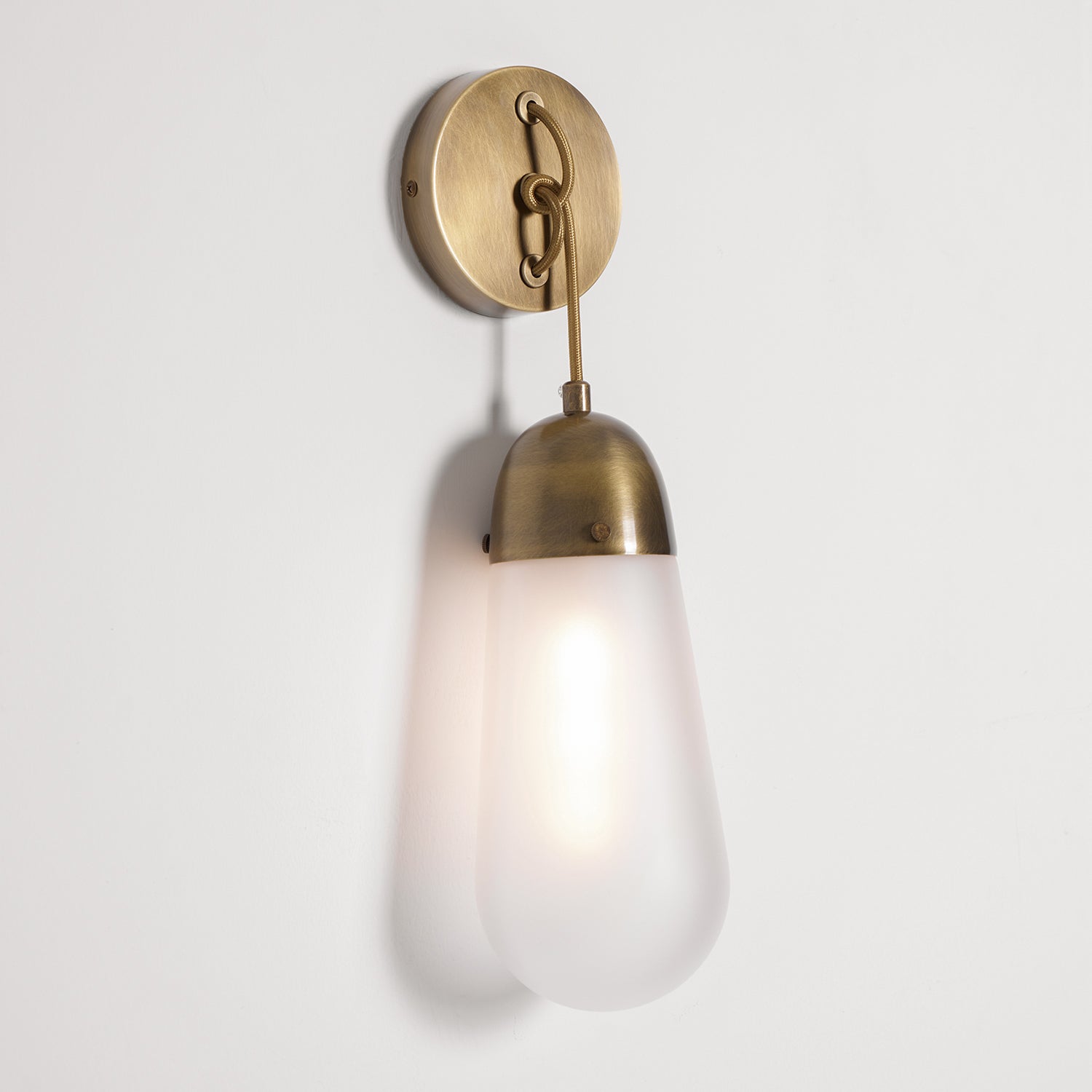 Lariat Wall Lamp, black finish, in an industrial-style space.