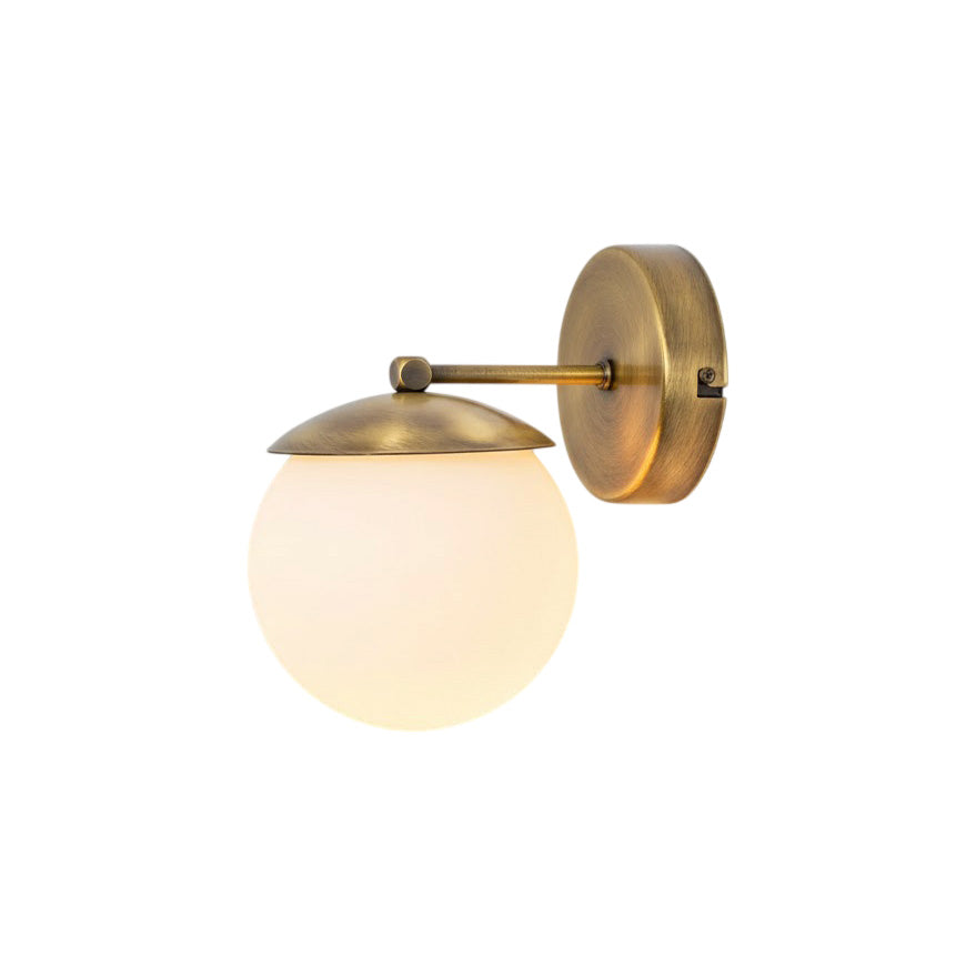 Lark Julep Wall Lamp with brass finish and glass sphere.