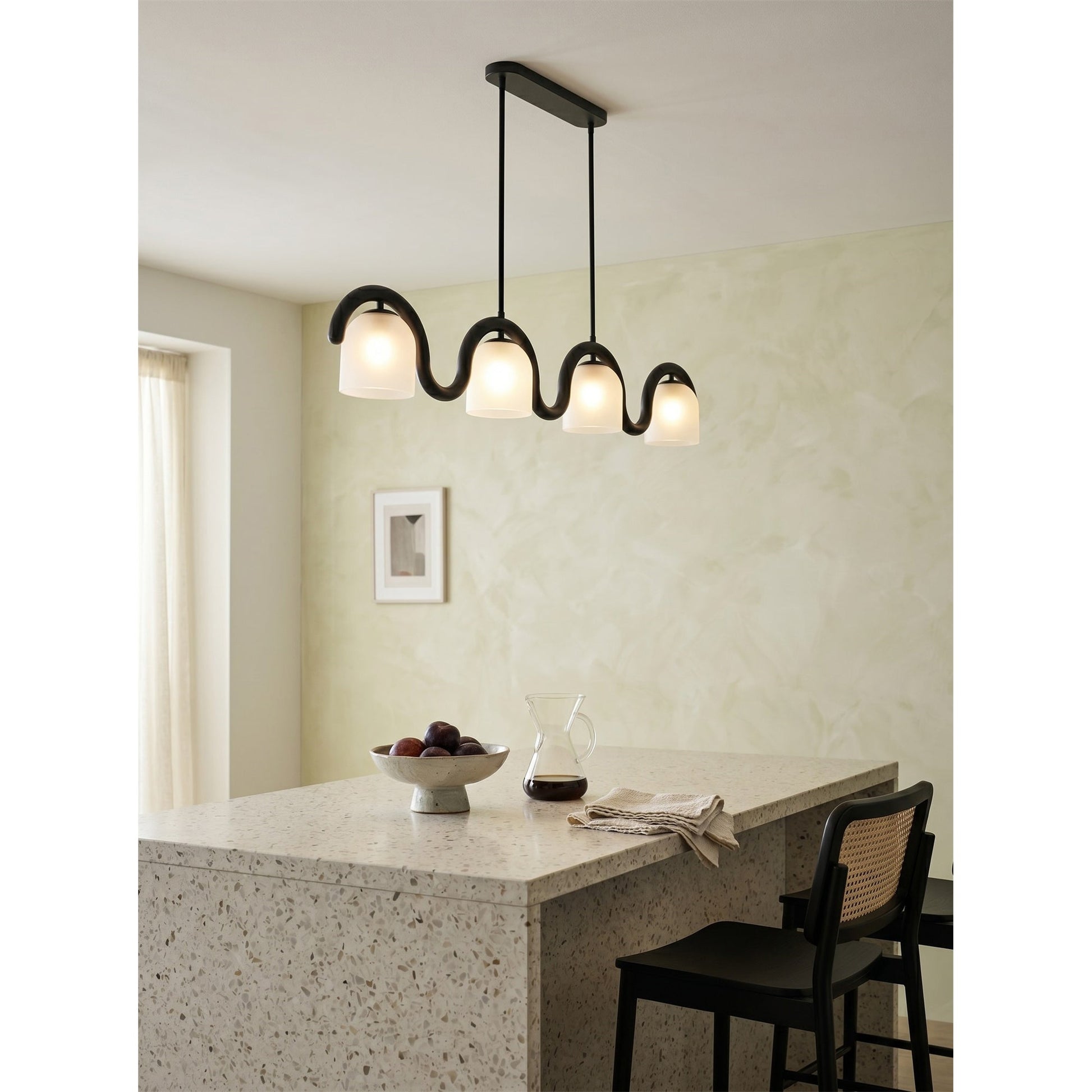 The black Lenox chandelier in an industrial-style kitchen.