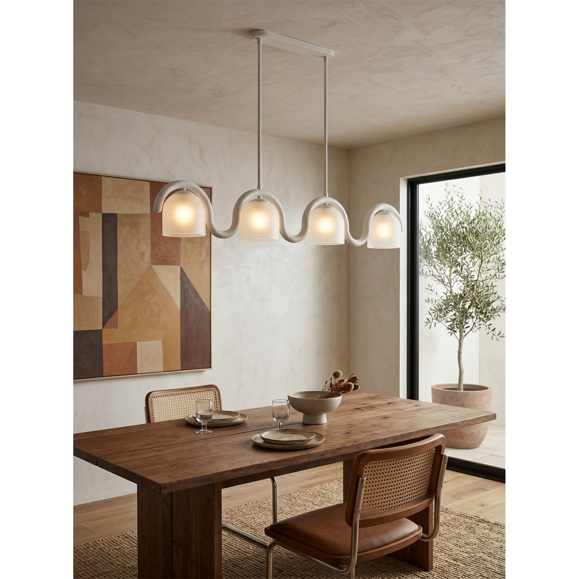The brass Lenox chandelier in an elegant dining room.
