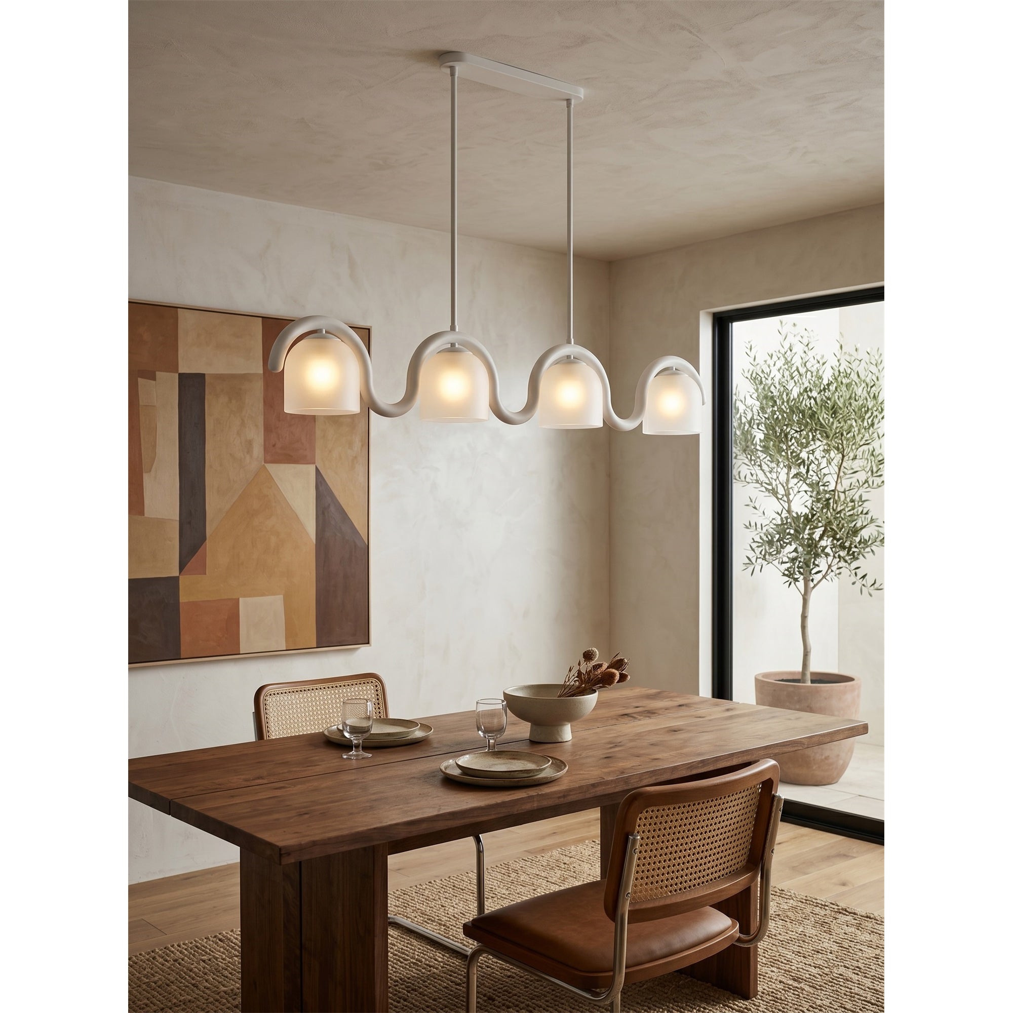 The brass Lenox chandelier in an elegant dining room.