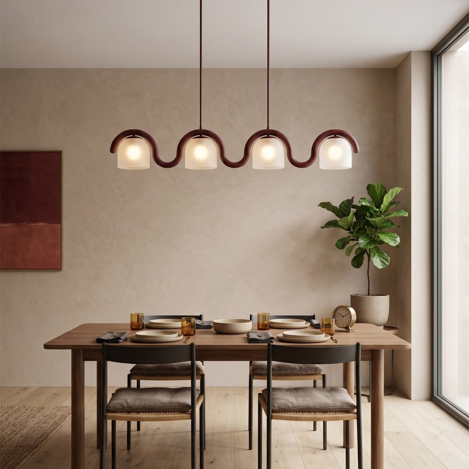 Angled view of the wavy brass body and four frosted glass shades of the Lenox chandelier.