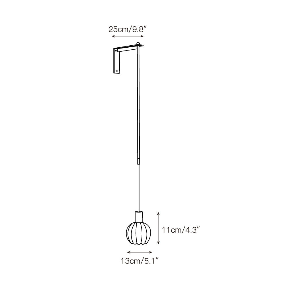 The wall lamp illuminated, casting a warm and diffused light.