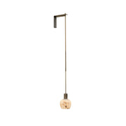 Lilin Alabaster Wall Lamp shown against a neutral wall.
