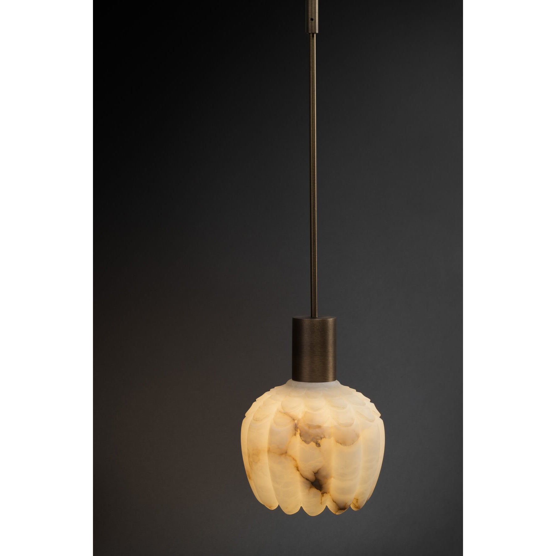 Side profile of the Lilin Alabaster Wall Lamp showcasing its metal body.