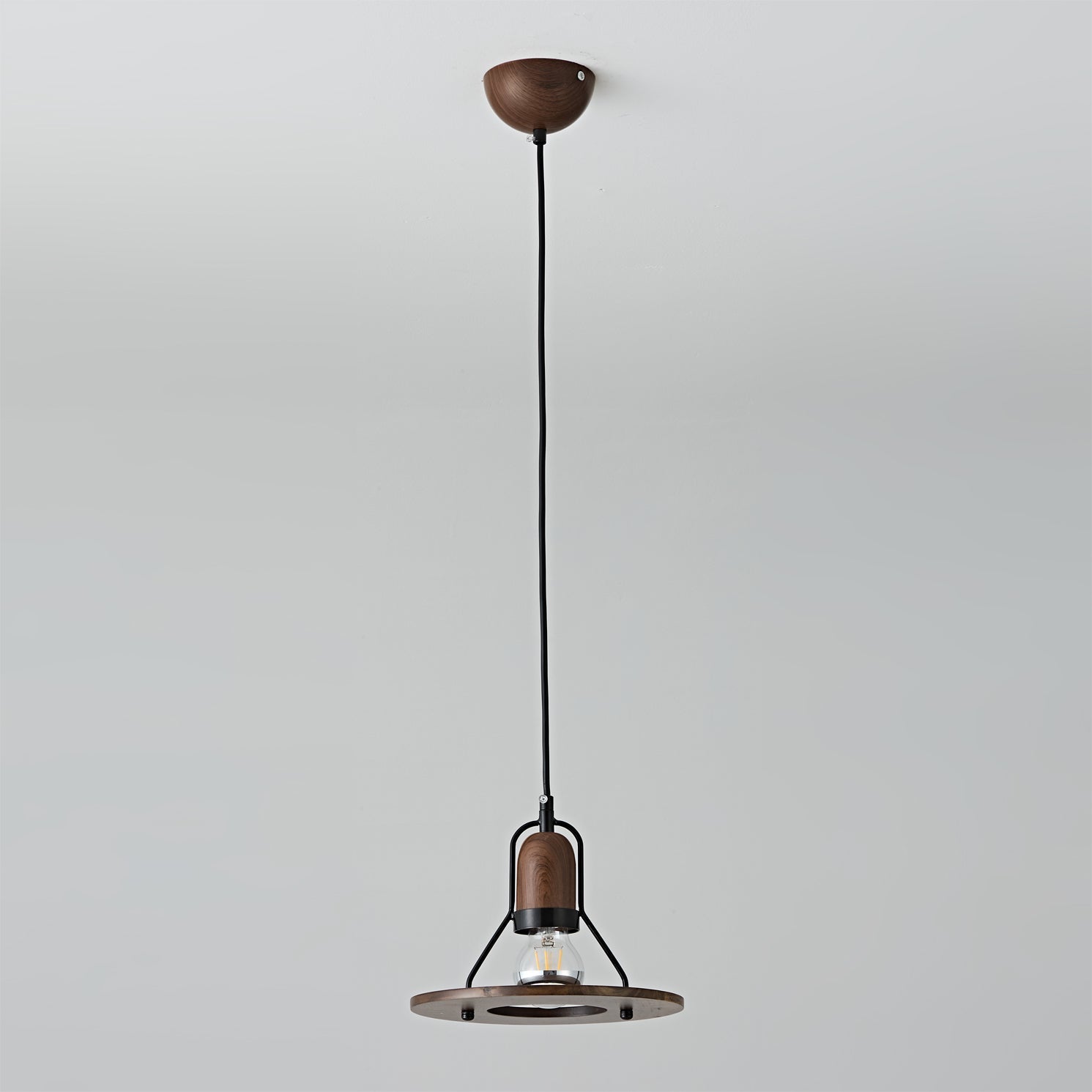 Lioren Pendant Lamp used as bedside lighting in a modern bedroom.