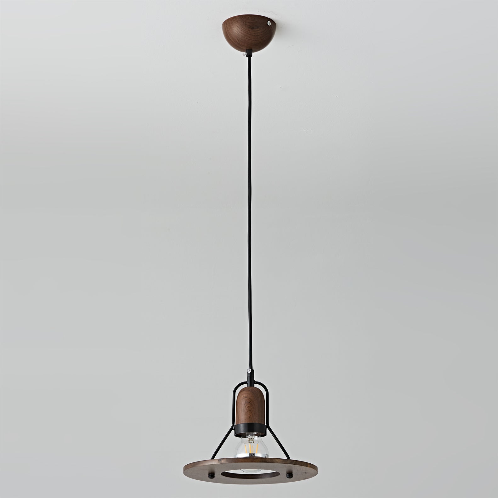 The Lioren Pendant Lamp illuminating a reading nook.