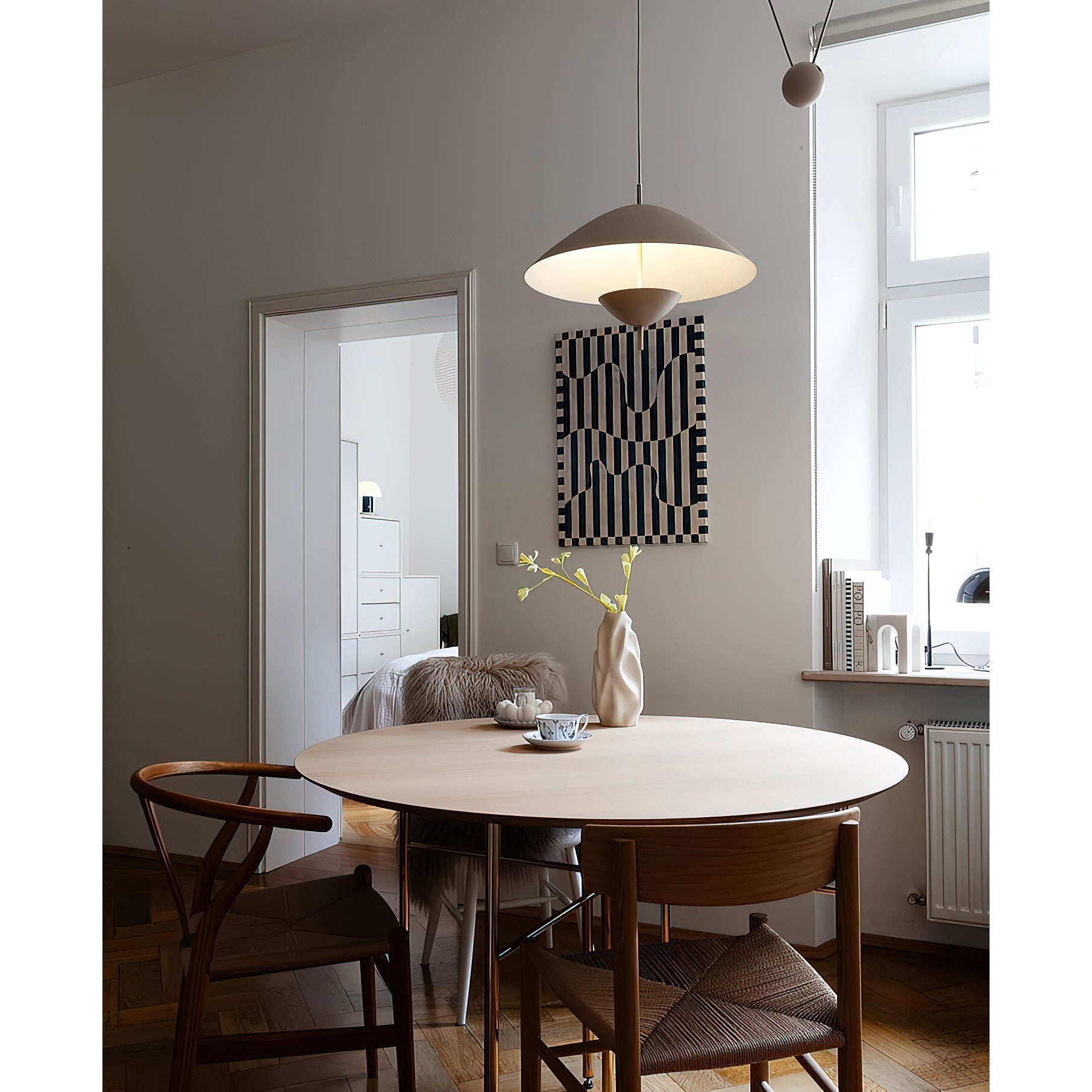 The adjustable perpendicular rod used for positioning the Lod Pendant Lamp.
