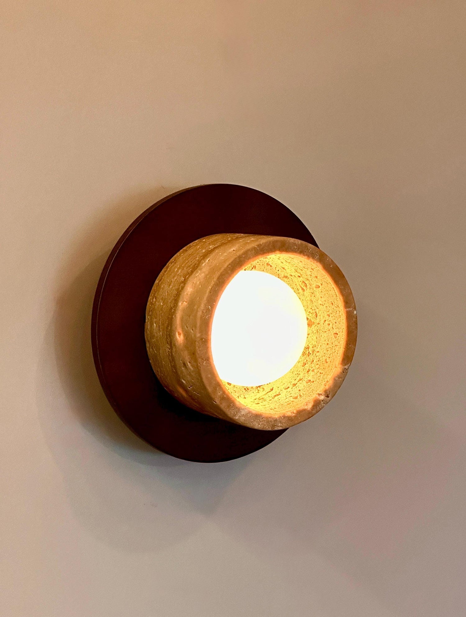 Logatec Traverine Wall Lamp in a stylish interior setting.