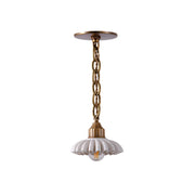 Lola Pendant Lamp with brass body and marble shade.