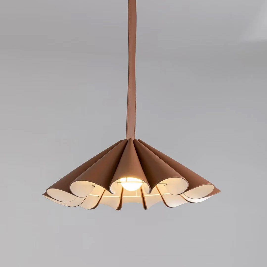 Side profile of the Lora Pendant Lamp against a neutral wall.
