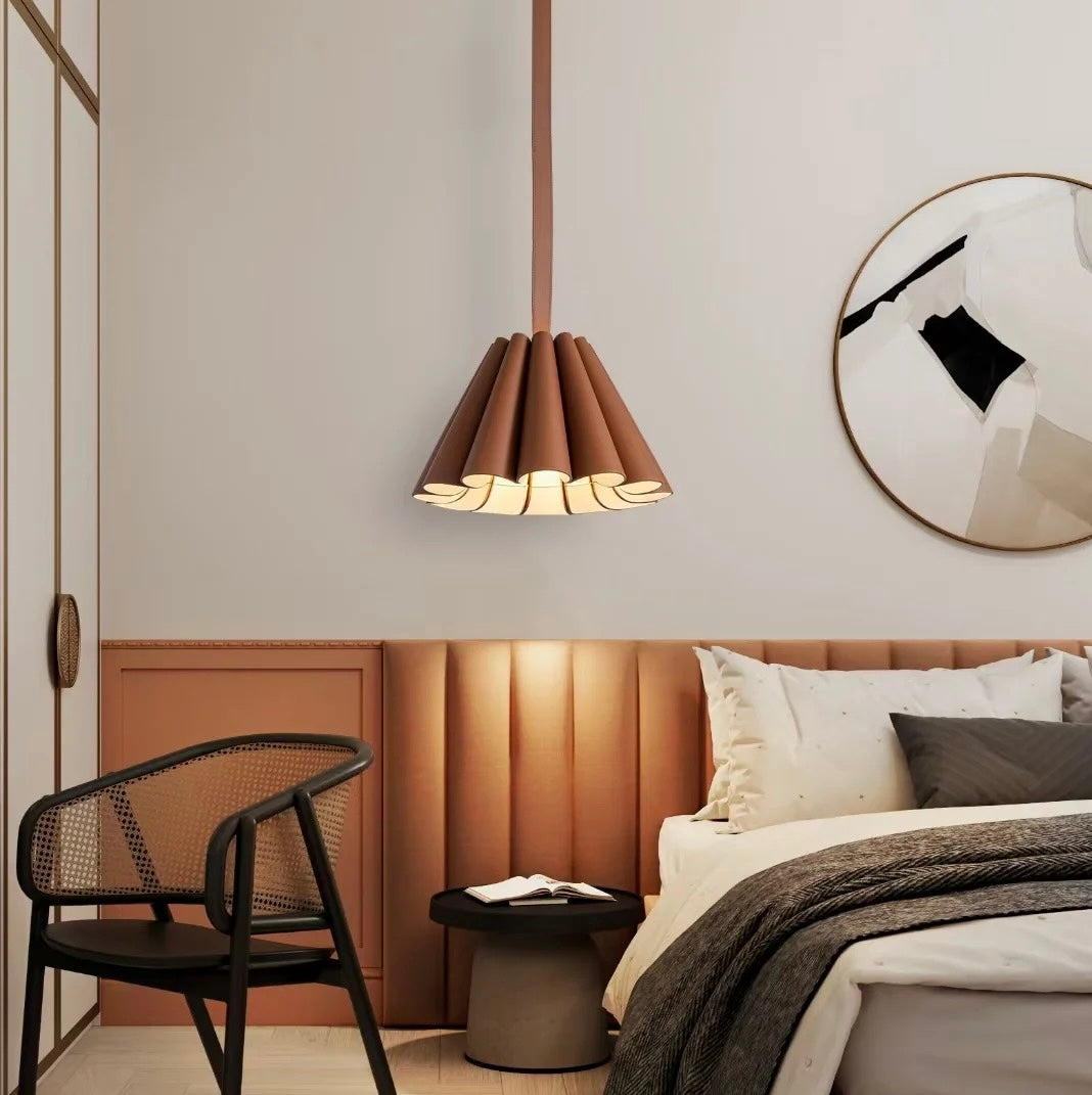 The smaller Lora Pendant Lamp providing ambient light in a cozy reading nook.
