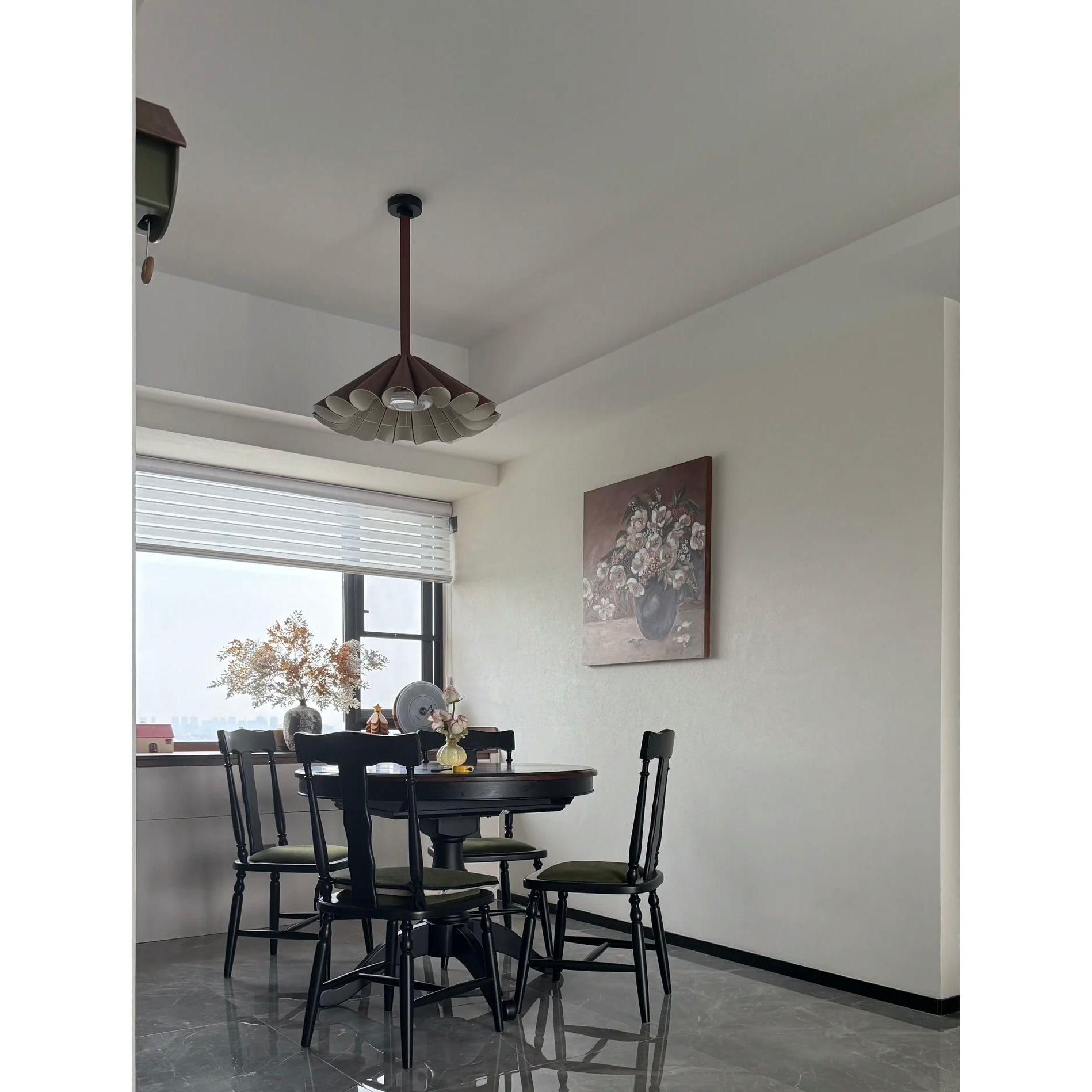 The Lora Pendant Lamp illuminated, casting a warm and inviting glow.