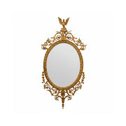 Front view of the Louis oval wall mirror with an ornate brass frame.