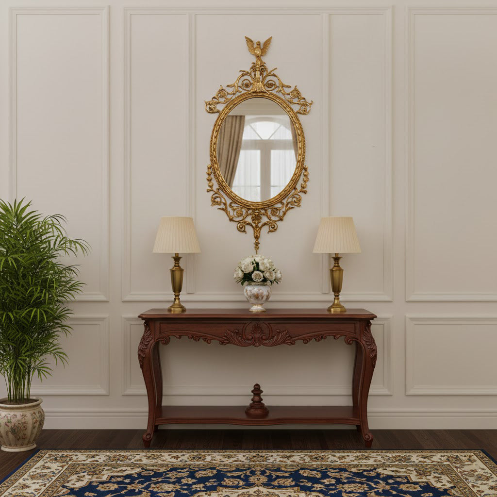 The Louis oval mirror displayed on a dark wall for contrast.