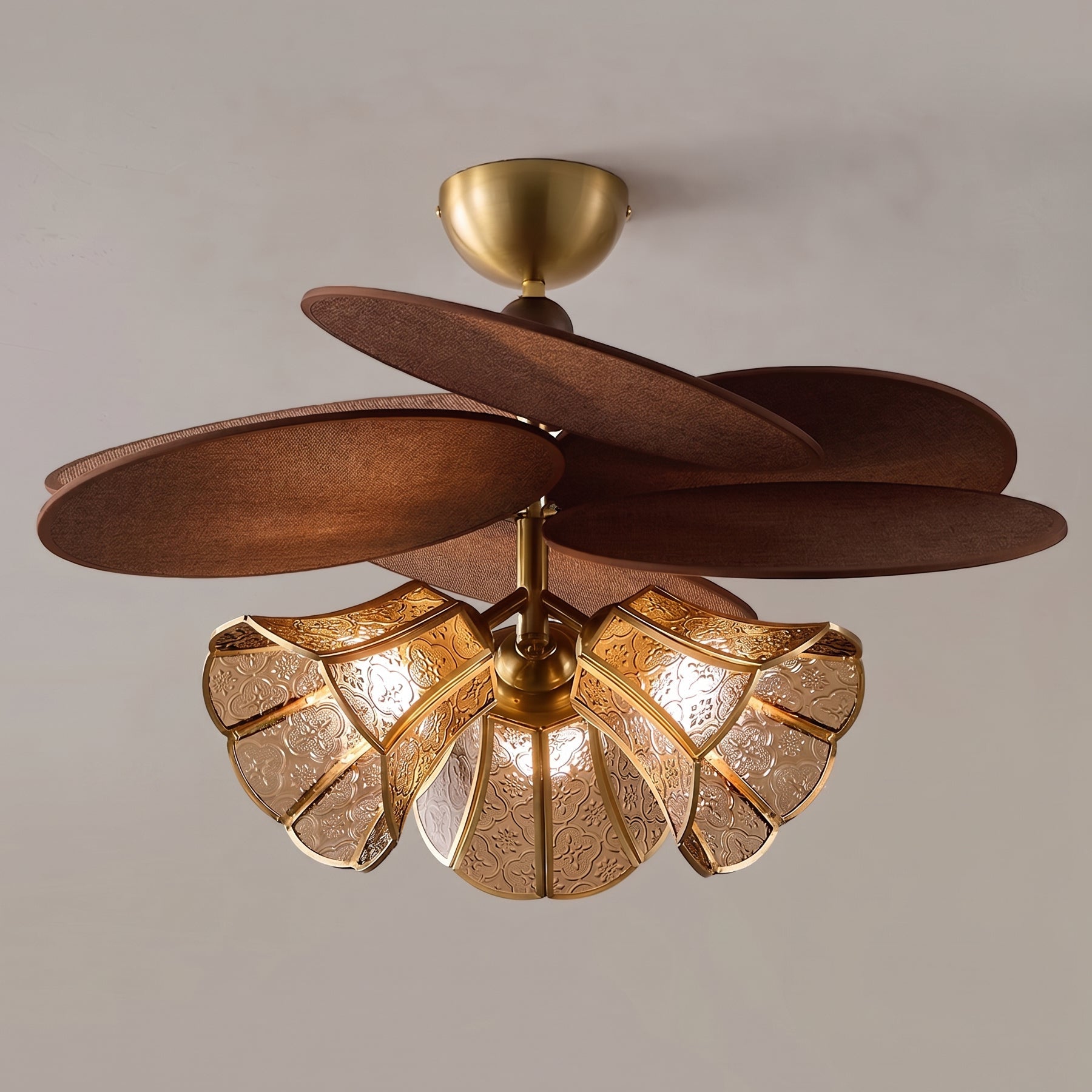 The Lucca Chandelier illuminated in a stylish living room setting.