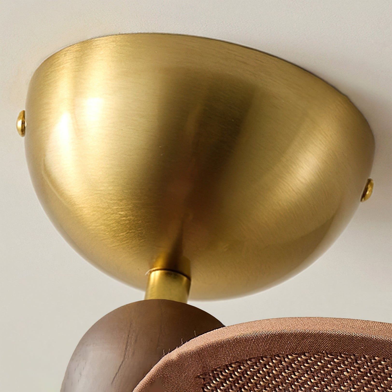 The Lucca Chandelier hanging over a dining table, providing warm ambient light.