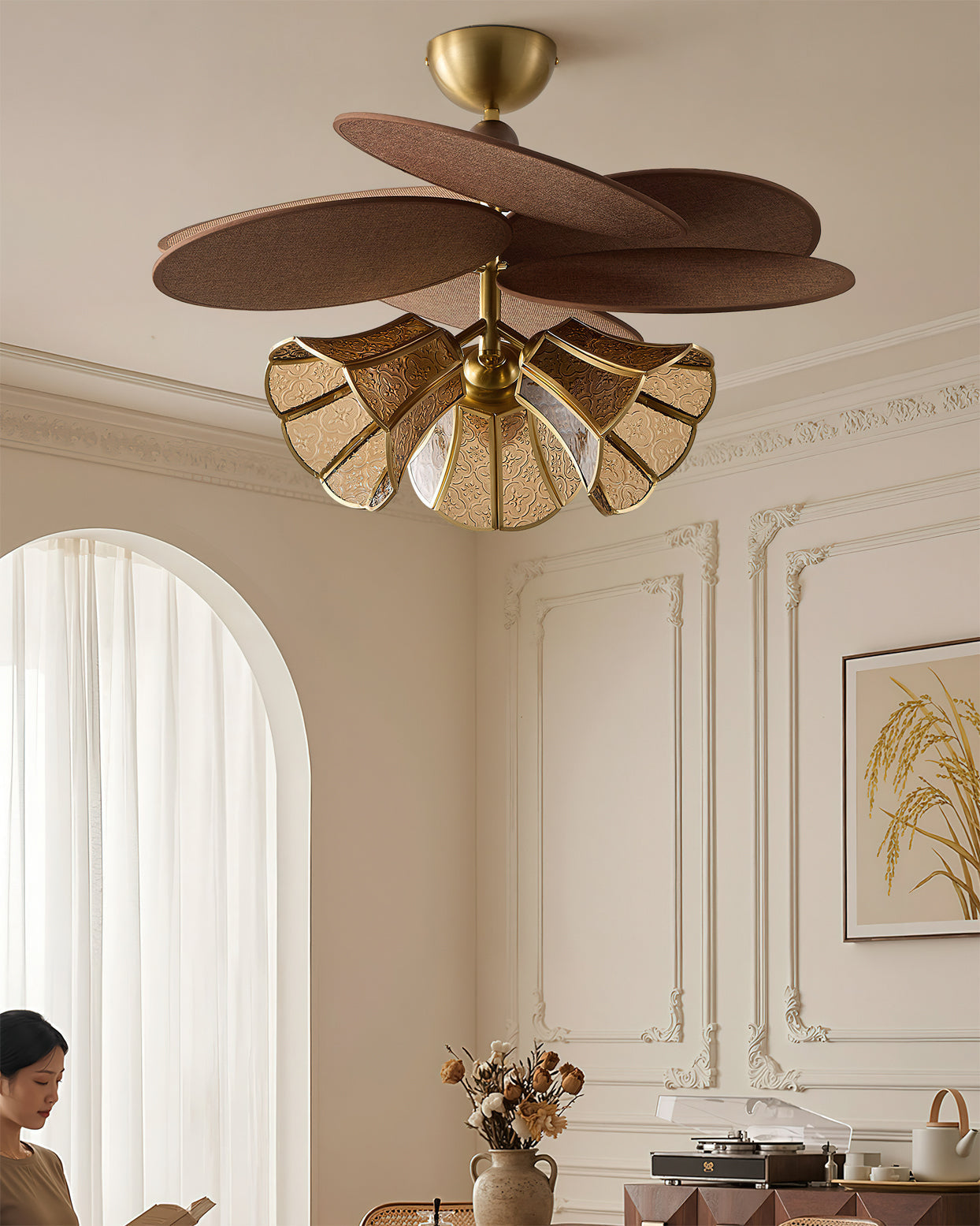 Close-up of a single embossed glass shade on the Lucca Chandelier.