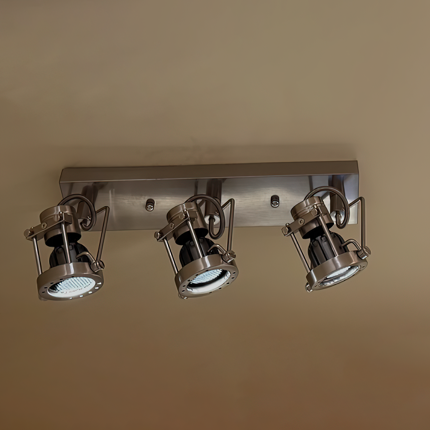 Lucide industrial ceiling lamp installed in a modern living room.