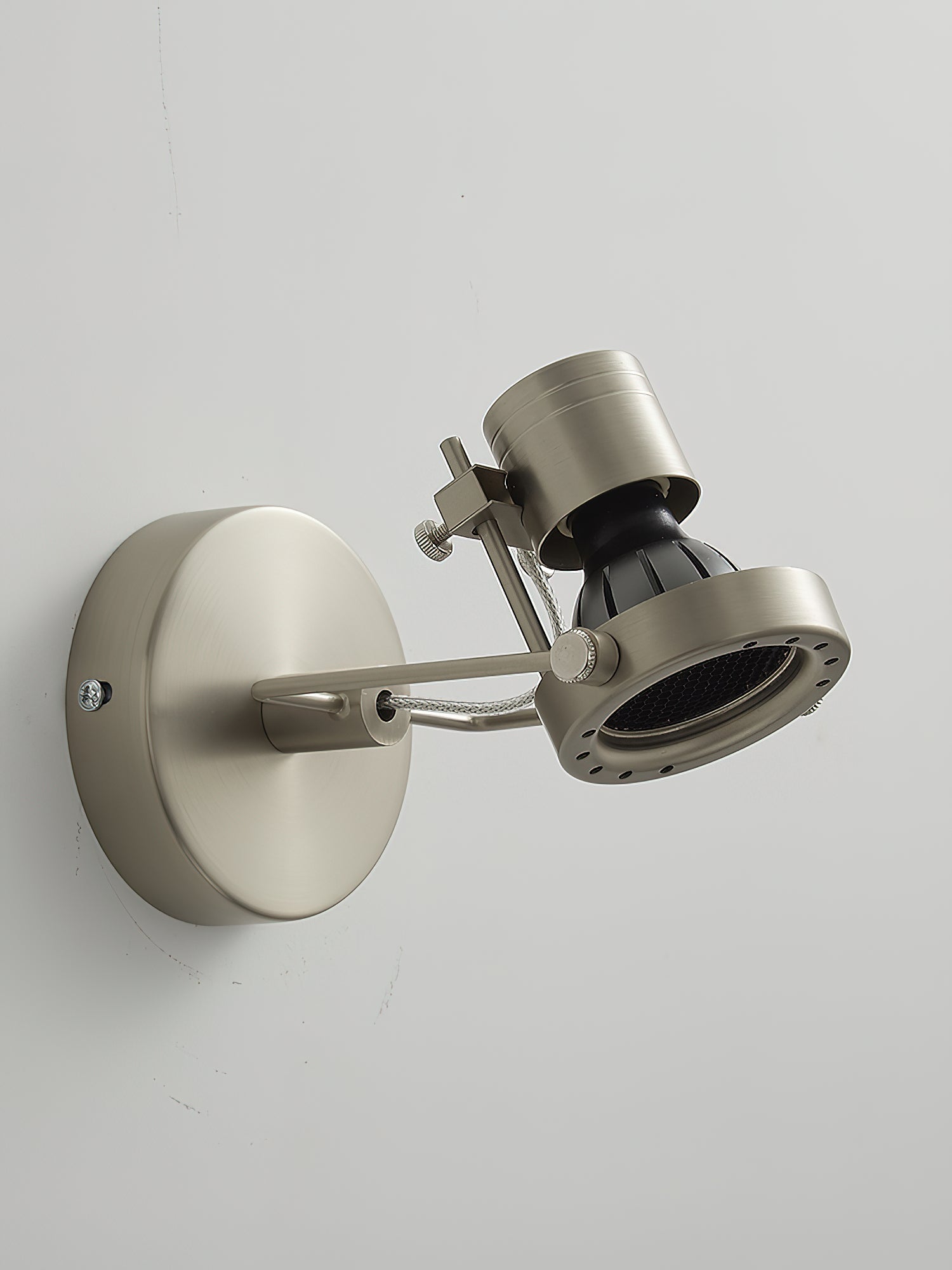 The clear glass lampshade of the industrial ceiling lamp.