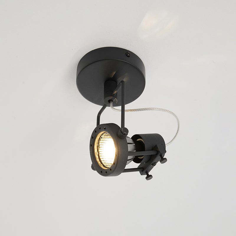 The industrial ceiling lamp installed on a ceiling, view from below.