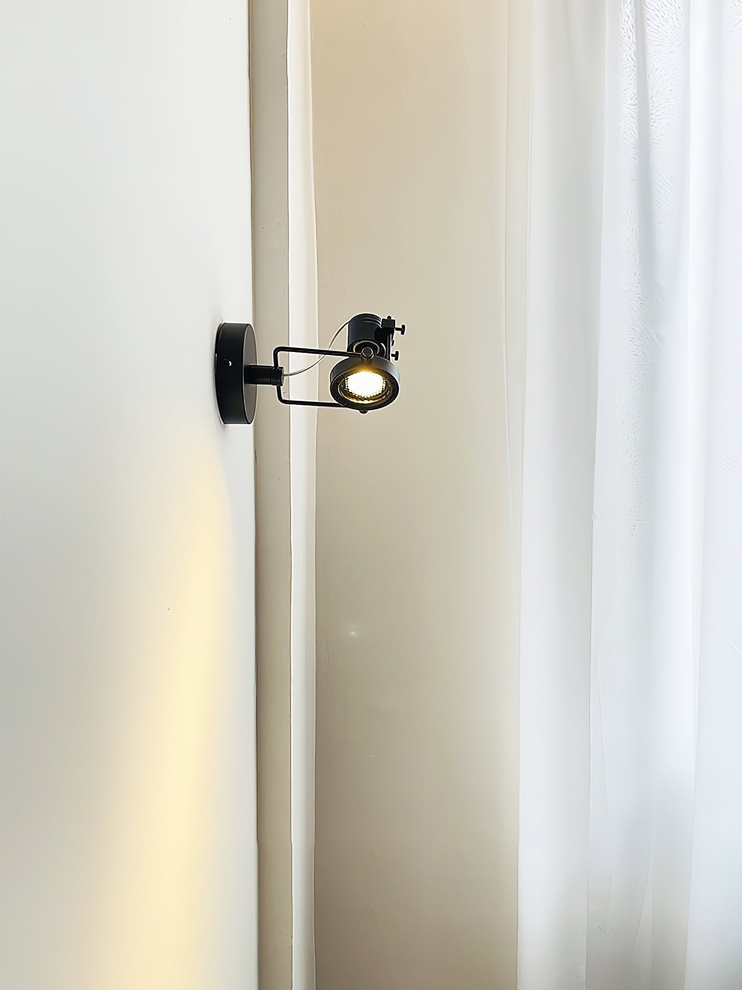 Industrial ceiling lamp shown from a low angle.