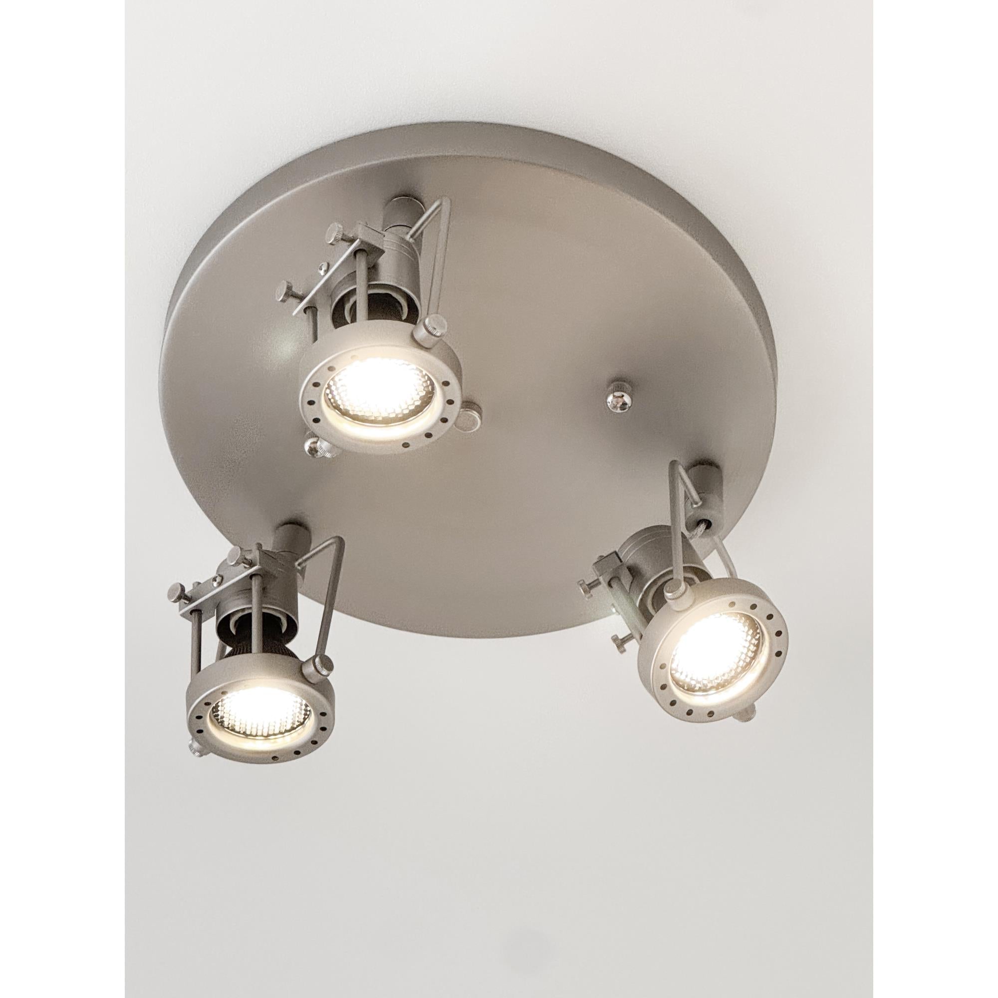Close-up detail of the brushed nickel finish on the lamp's metal frame.