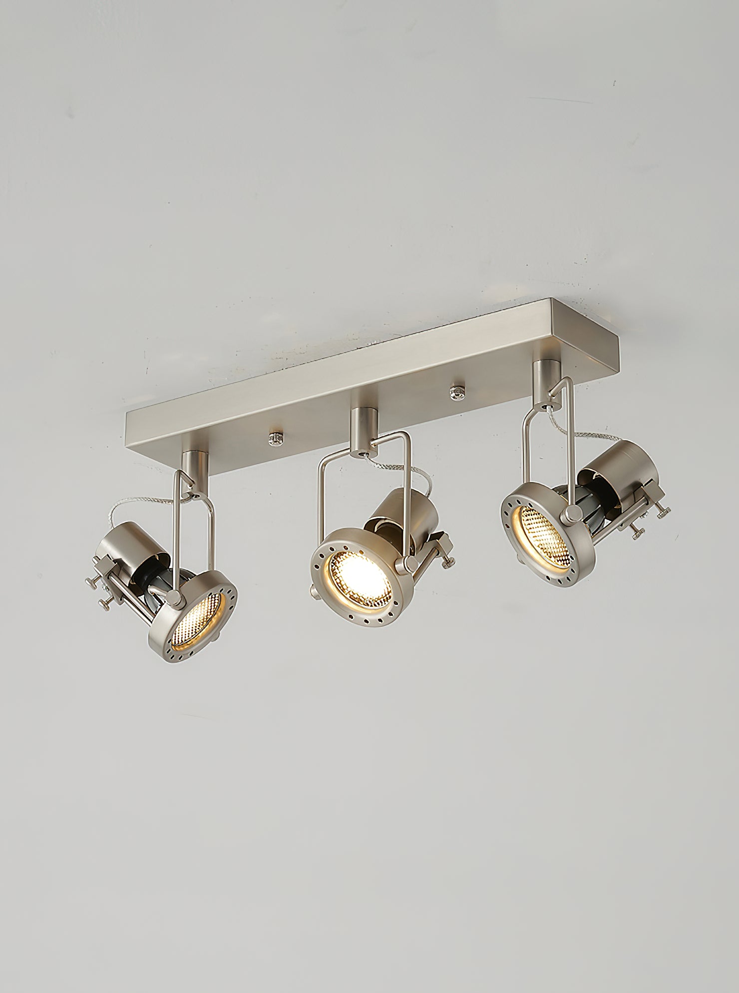 Top-down view of the 3-head circular ceiling lamp.