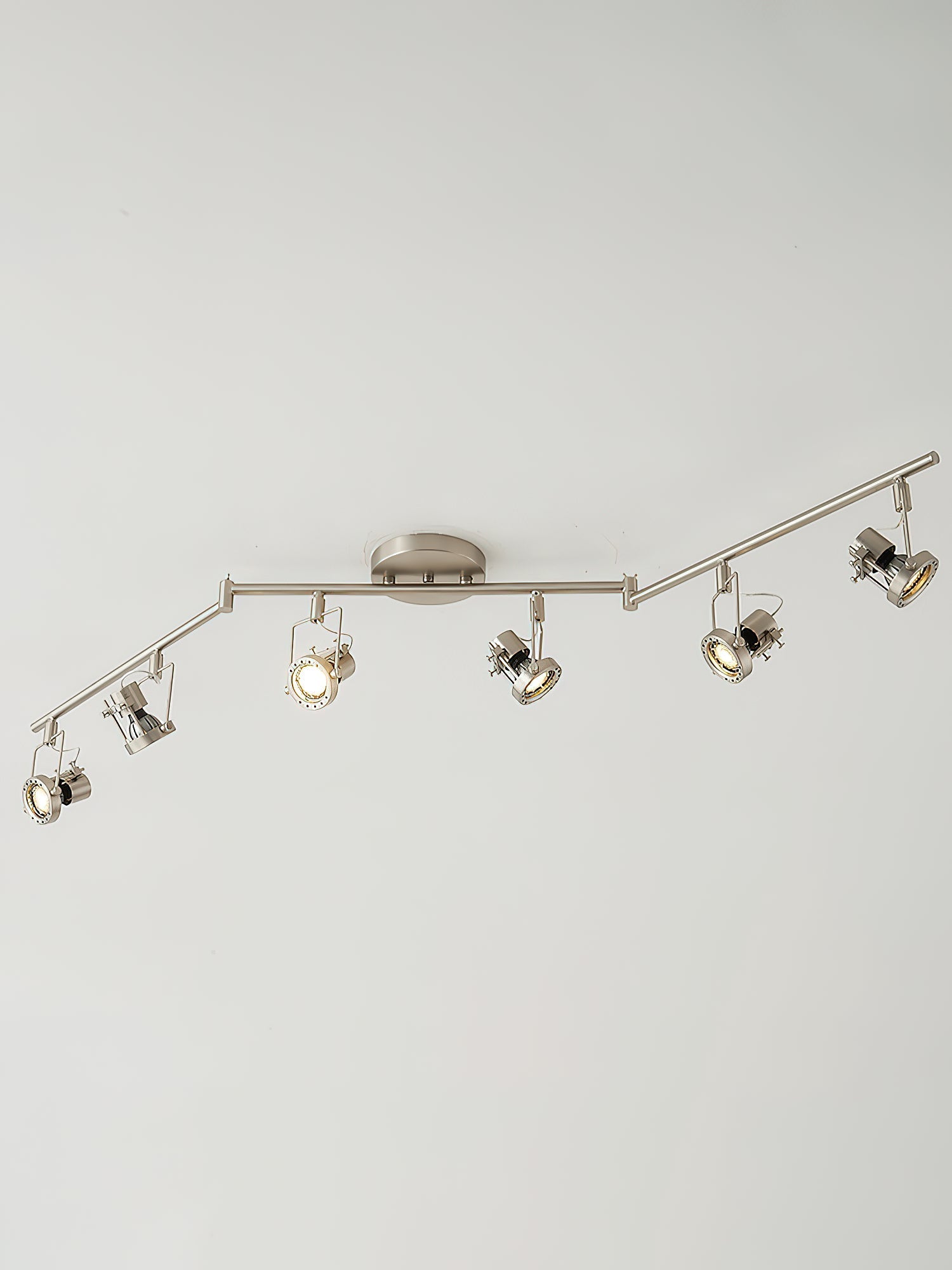 Lucide track lamp installed in a modern living room setting.