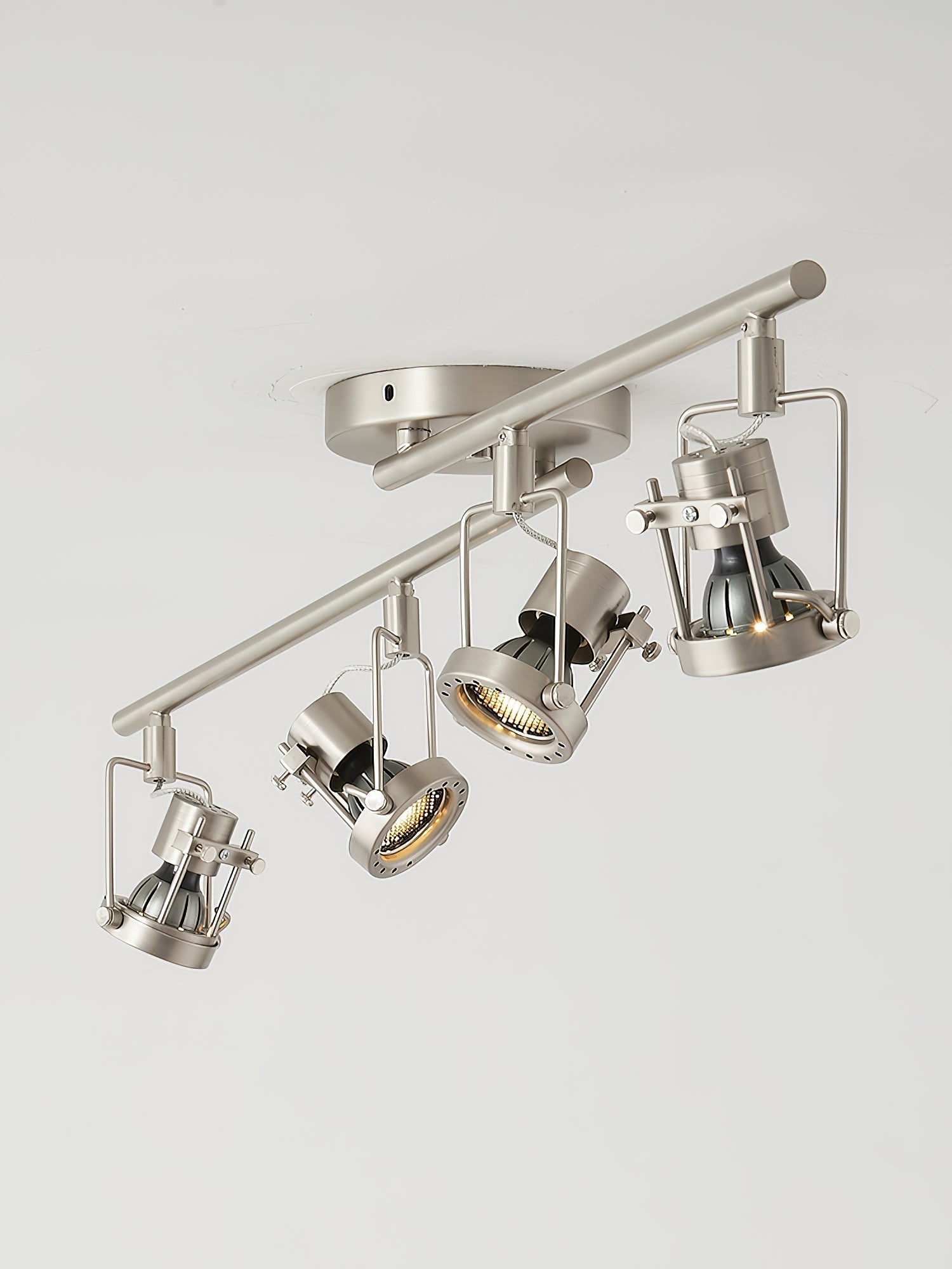 Detail view of the adjustable head on the industrial track lamp.