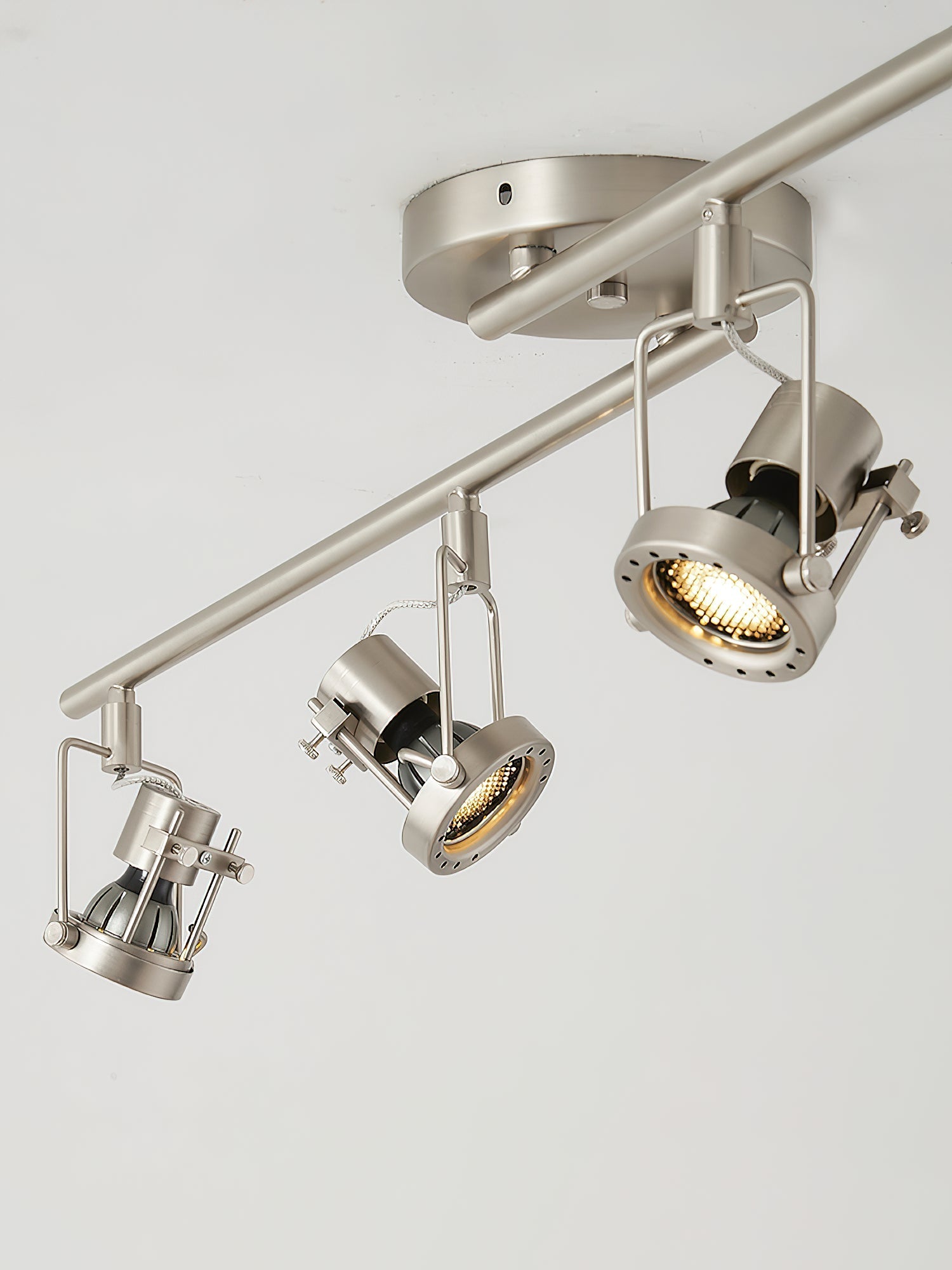 View of the track lamp from below, showing all light heads.
