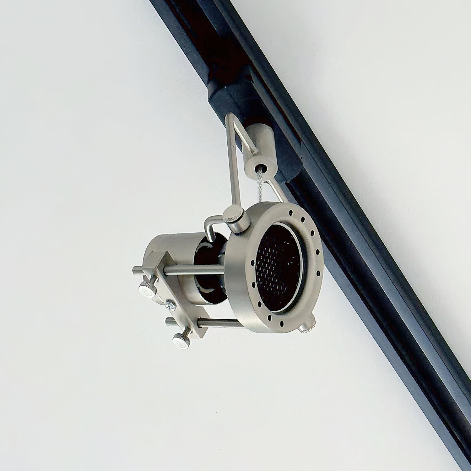 Three-head nickel industrial track light system on a 1.5-meter track.