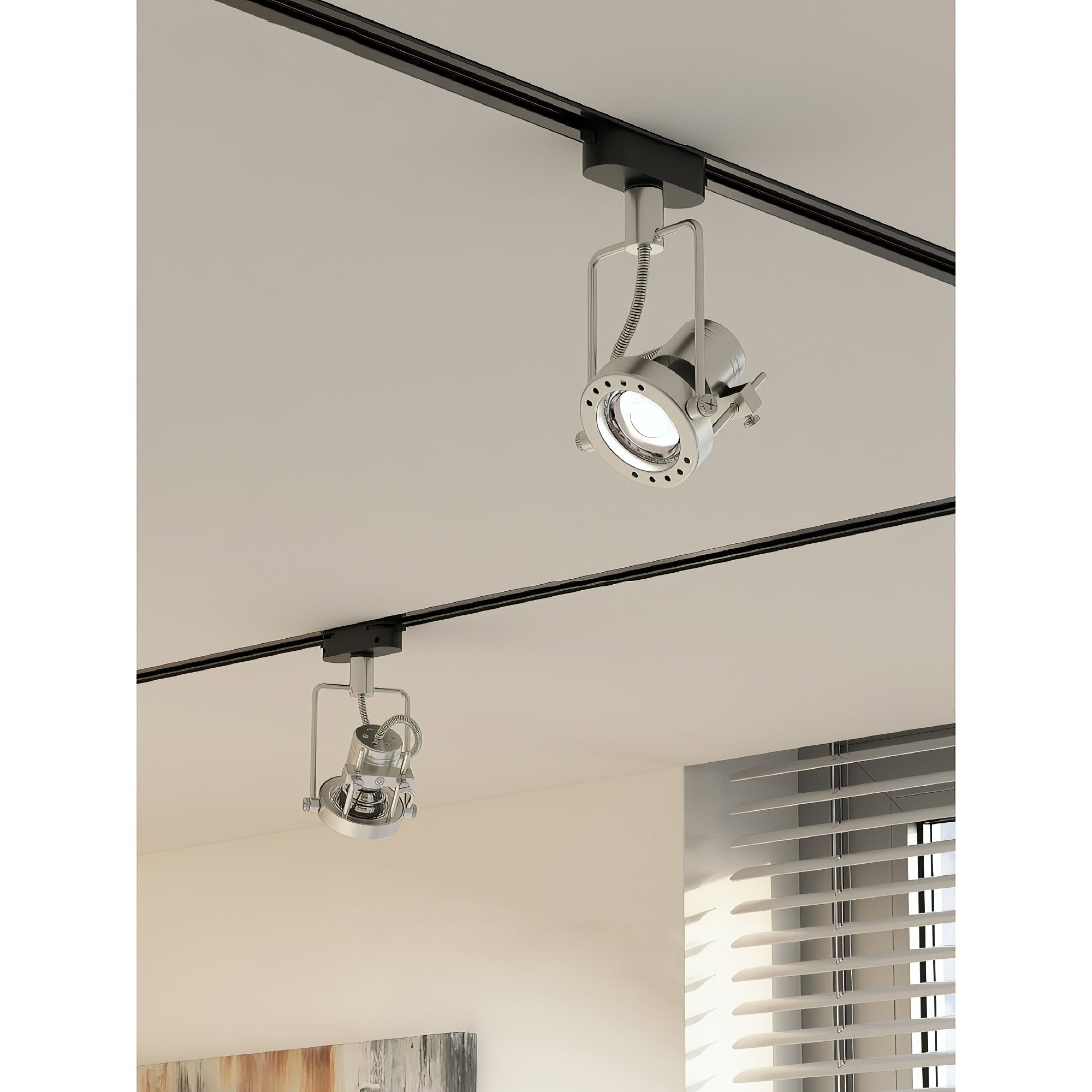 Black industrial track light installed in a modern living room setting.