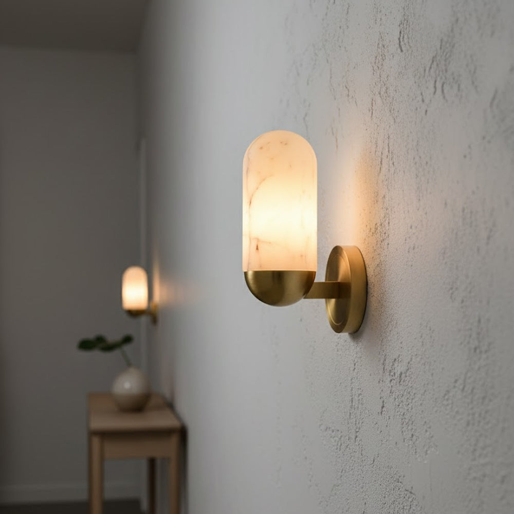 The wall lamp illuminated, casting a warm and gentle glow.