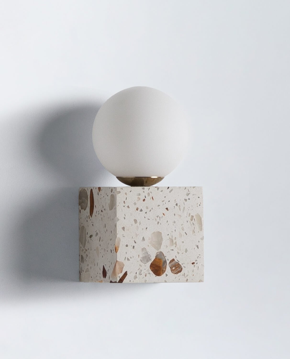 Detail shot of the glass lampshade and G9 socket fixture.